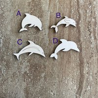 Handmade wood dolphin cutouts in four unique DIY craft styles