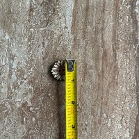 Handmade wooden sunflower buttons with detailed petals for craft projects