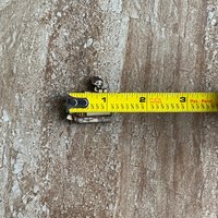 Handmade wooden book-shaped buttons for crafts, sewing, and scrapbooking projects