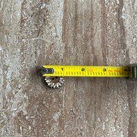 Handmade wooden sunflower buttons with detailed petals for craft projects