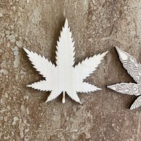 Handmade wooden DIY marijuana leaf cutout in two unique styles, ready for paint or decorating