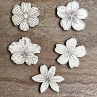 Handmade wooden DIY tropical flower cutouts in five unique styles, ready for paint or decorating