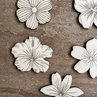 Handmade wooden DIY tropical flower cutouts in five unique styles, ready for paint or decorating