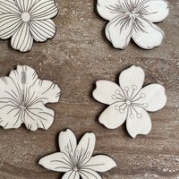 Handmade wooden DIY tropical flower cutouts in five unique styles, ready for paint or decorating