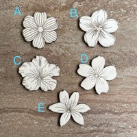 Handmade wooden DIY tropical flower cutouts in five unique styles, ready for paint or decorating