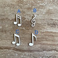 Handmade wooden DIY musical note cutout in four unique styles, ready for paint or decorating