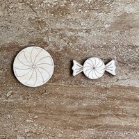 Handmade wooden DIY hard candy disk cutout in two unique styles, ready for paint or decorating
