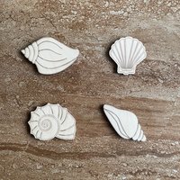 Handmade wooden DIY sea shell cutout in four unique styles, ready for paint or decorating
