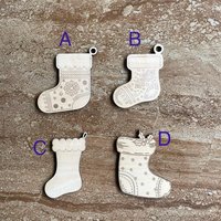Handmade wooden DIY Christmas stocking cutout in four unique styles, ready for paint or decorating