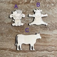 Handmade wooden DIY cow cutout in three unique styles, ready to paint or decorate