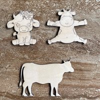 Handmade wooden DIY cow cutout in three unique styles, ready to paint or decorate
