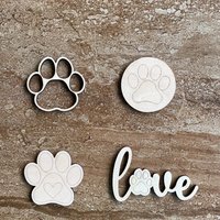 Handmade wooden DIY paw print cutout in four unique styles, ready to paint or decorate