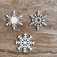 Handmade wooden DIY snowflake cutout in three unique styles, ready for paint or decorating