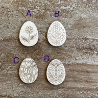 Handmade wooden DIY Easter egg cutout in four unique styles, ready for paint or decorating