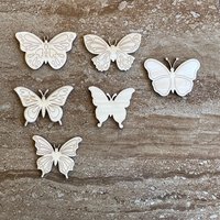 Handmade wooden DIY butterfly cutout in six unique styles, ready to paint or decorate
