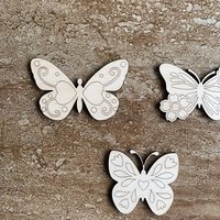 Handmade wooden DIY butterfly cutout in three unique styles, ready to paint or decorate