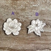 Handmade wooden DIY magnolia flower cutouts in two unique styles, ready for paint or decorating