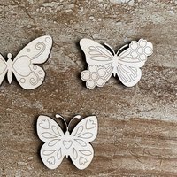 Handmade wooden DIY butterfly cutout in three unique styles, ready to paint or decorate