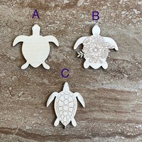 Handmade wooden DIY turtle cutout in three unique styles, ready for paint or decorating