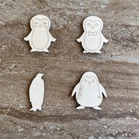 Handmade wooden DIY penguin cutout in four unique styles, ready to paint or decorate