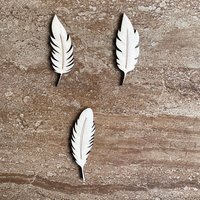 Handmade wooden DIY feather cutout in three unique styles, ready for paint or decorating