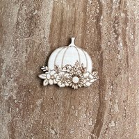 Handmade wooden DIY pumpkin cutout ready for paint or decorating