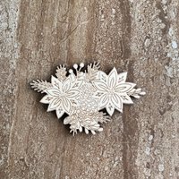 Handmade wooden DIY poinsettia cutout ready for paint or decorating