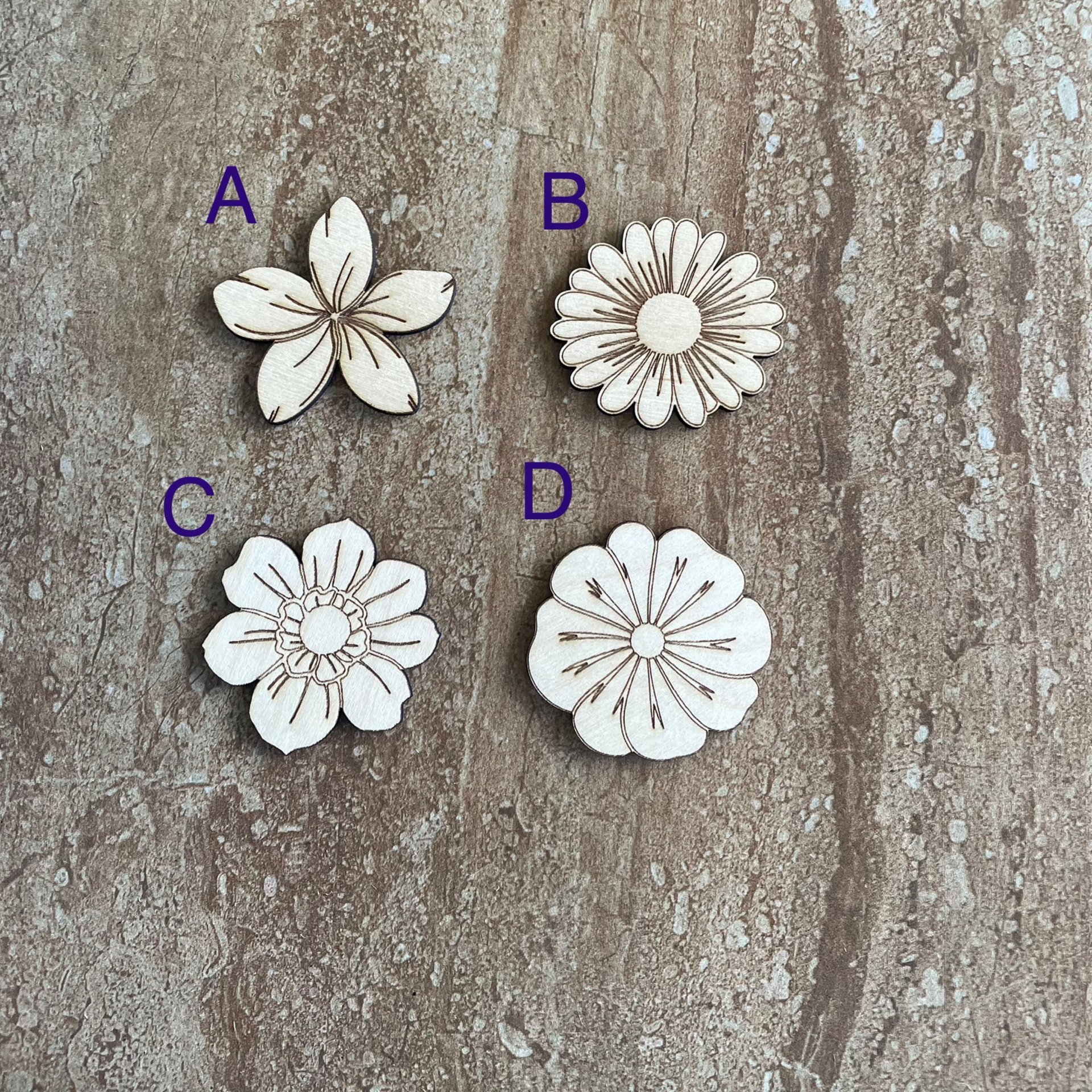 Handmade wood DIY flower cutouts in four different styles for crafts and painting projects