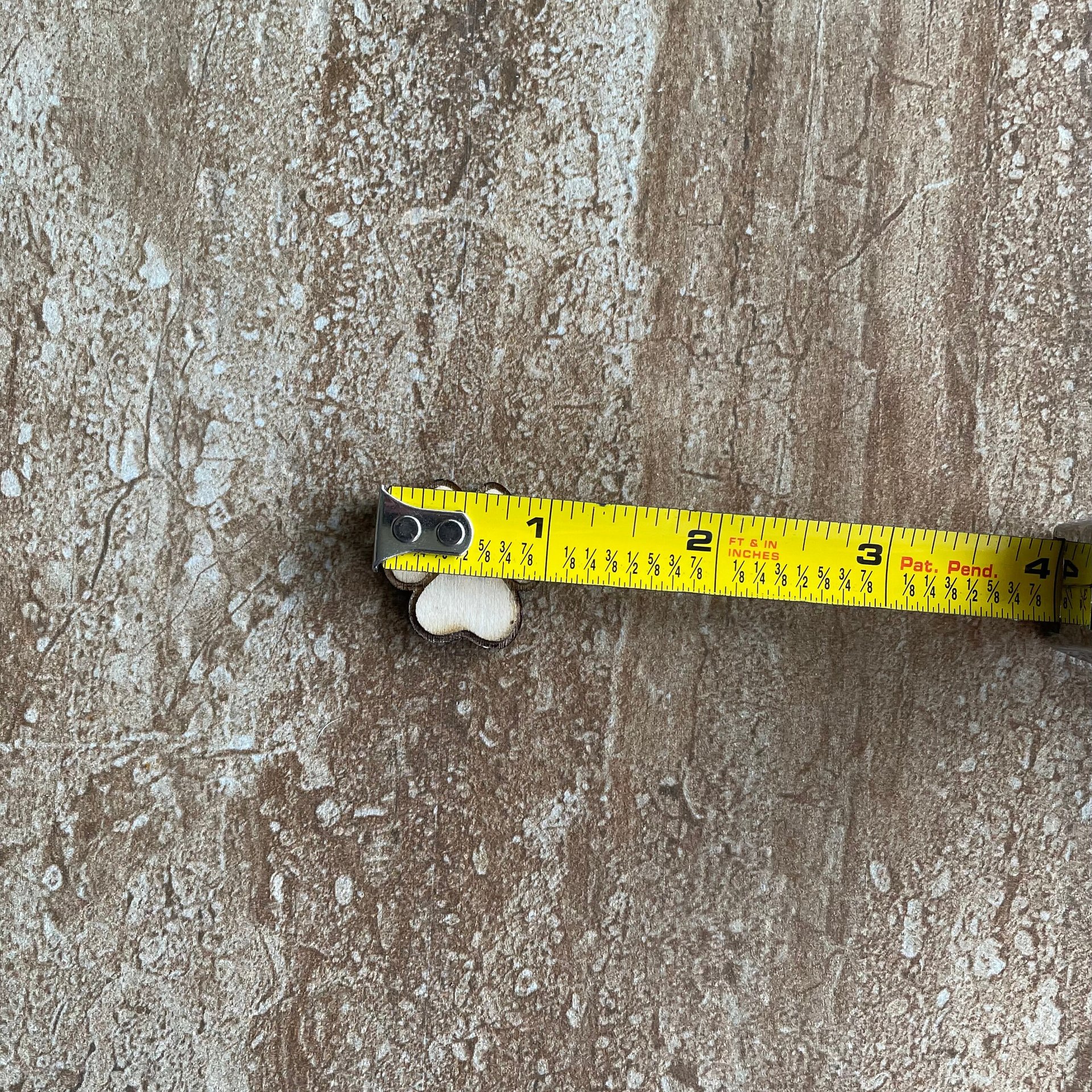 Laser-cut wood paw print buttons for sewing and scrapbooking