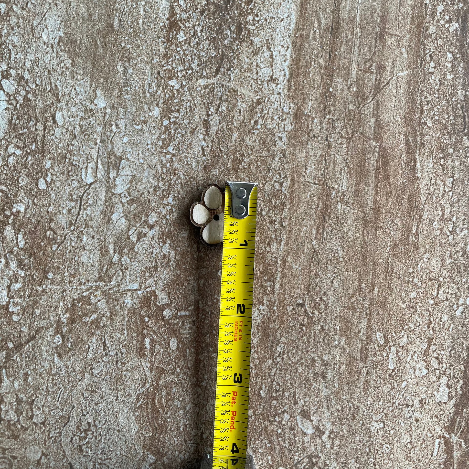 Laser-cut wood paw print buttons for sewing and scrapbooking