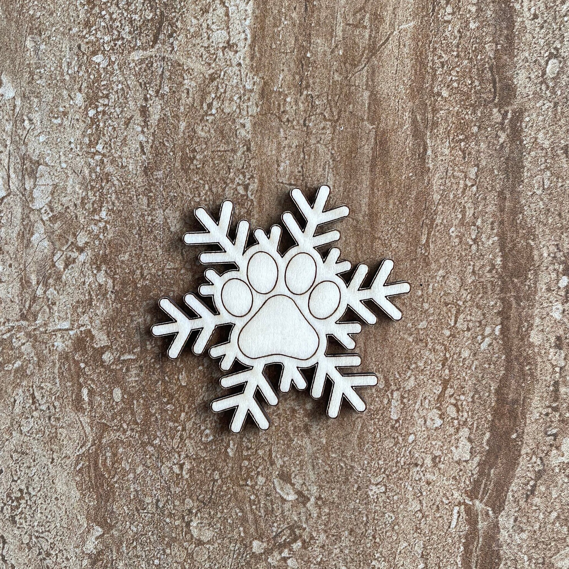 Handmade wooden DIY pawprint snowflake cutout ready for paint or decorating