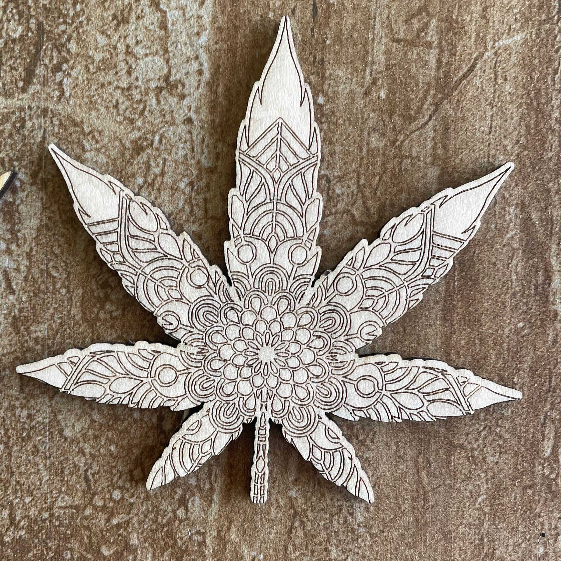 Handmade wooden DIY marijuana leaf cutout in two unique styles, ready for paint or decorating