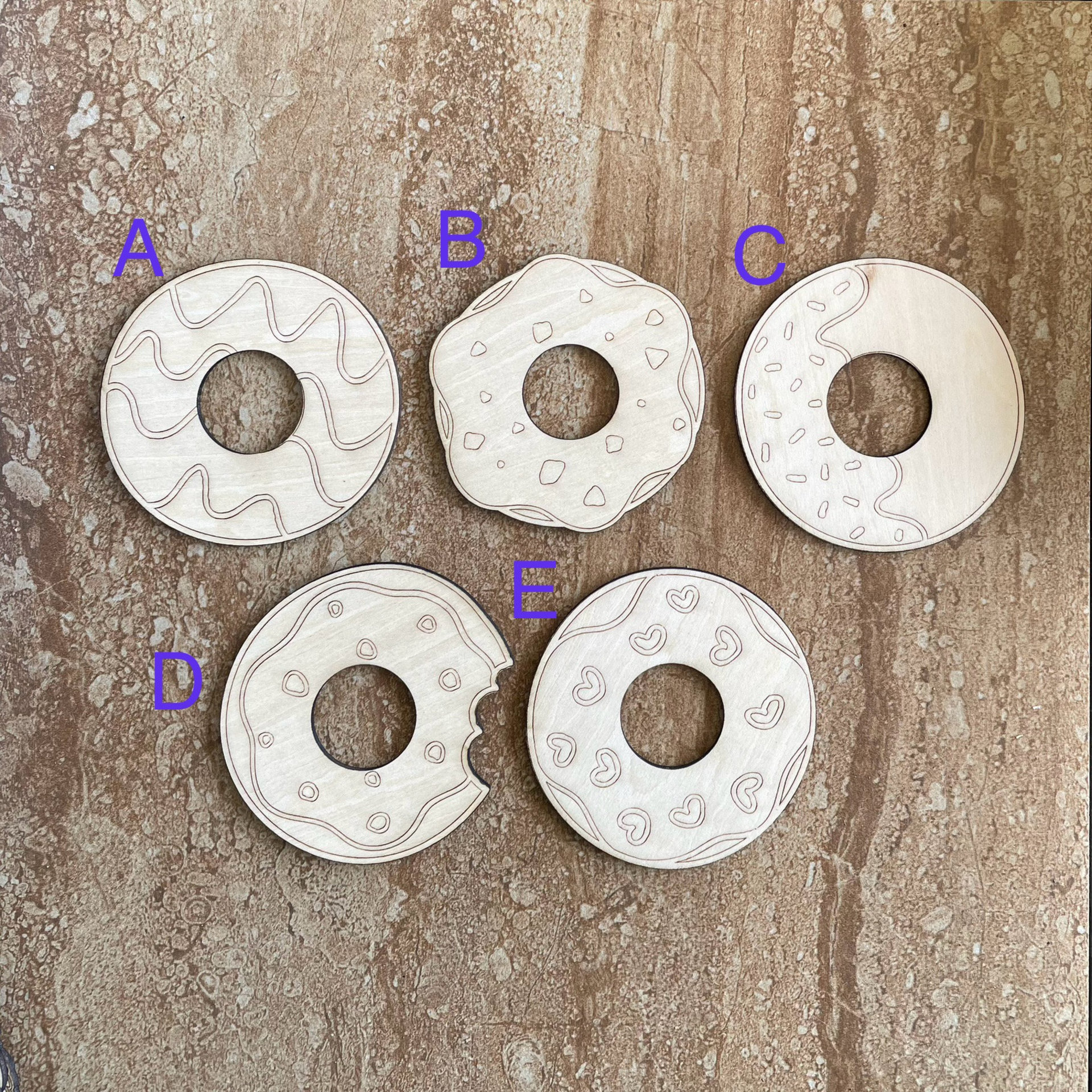 Handmade wooden DIY donut cutout in five unique styles, ready for paint or decorating
