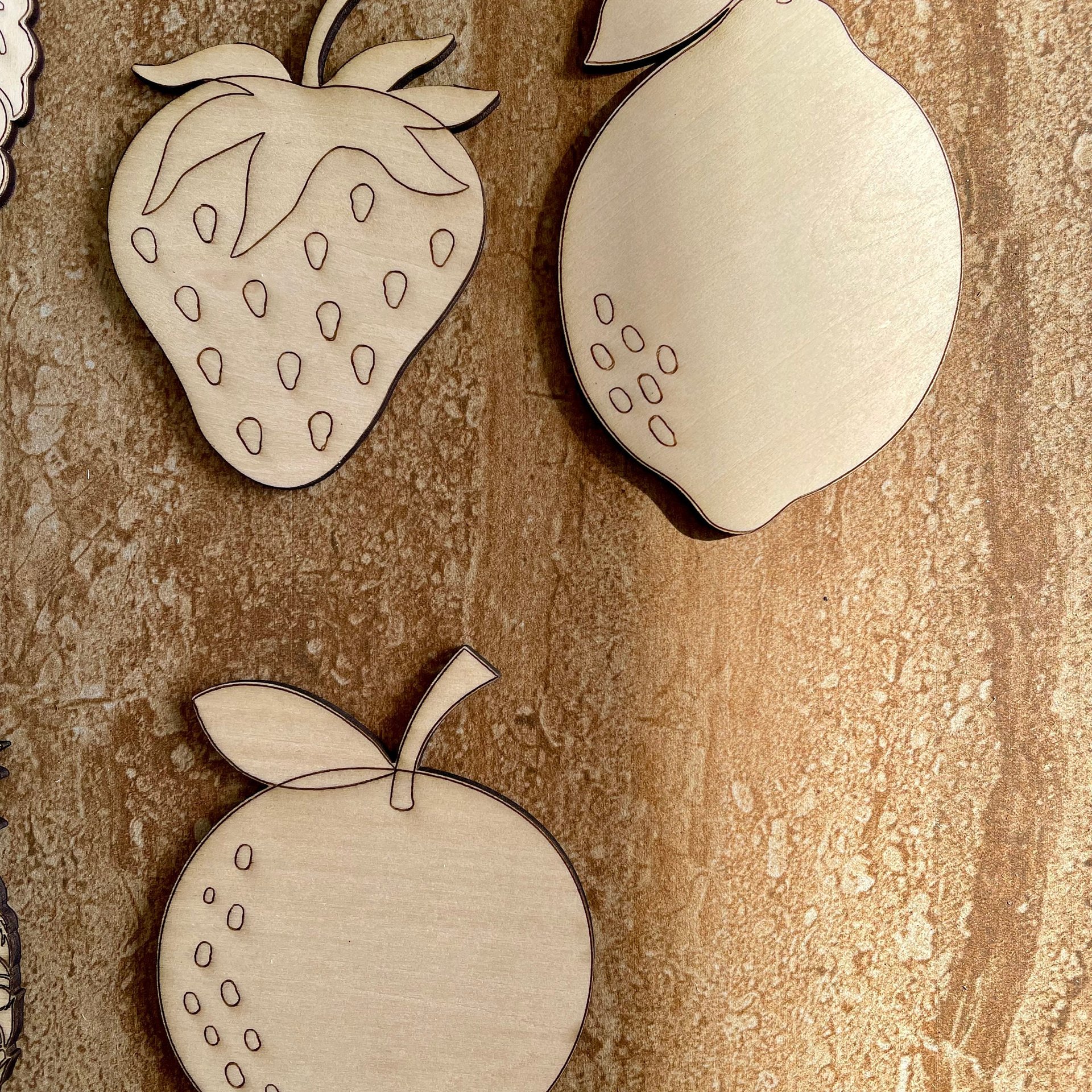 Handmade wooden DIY fruit cutout in five unique styles, ready for paint or decorating