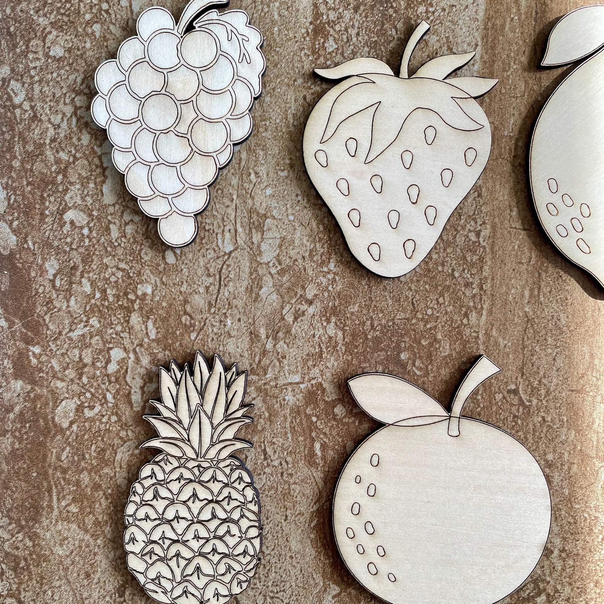 Handmade wooden DIY fruit cutout in five unique styles, ready for paint or decorating