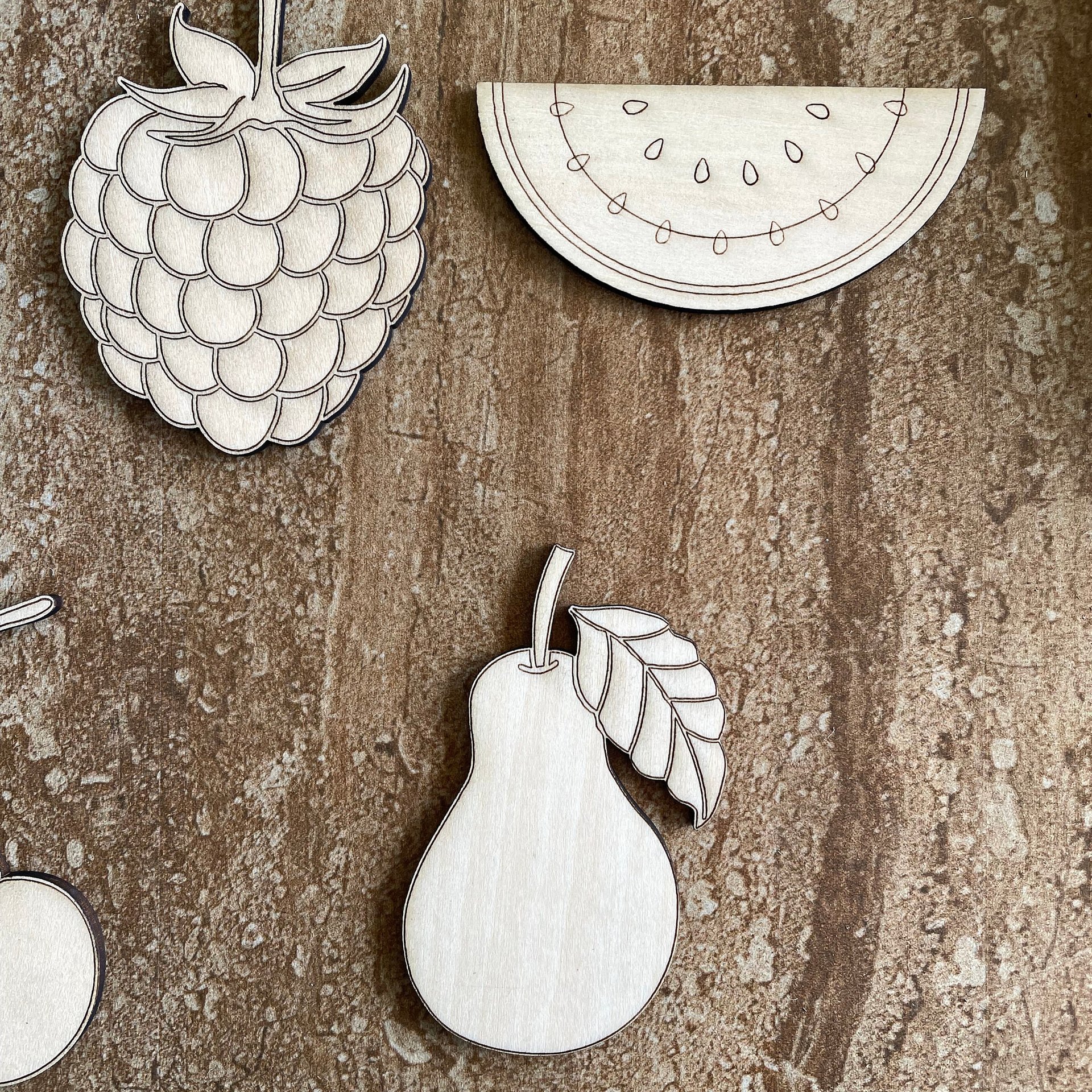 Handmade wooden DIY fruit cutout in five unique styles, ready for paint or decorating