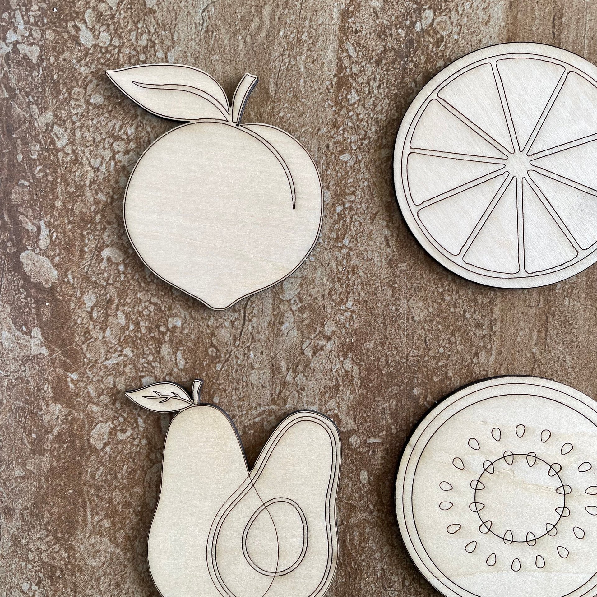 Handmade wooden DIY fruit cutout in four unique styles, ready for paint or decorating