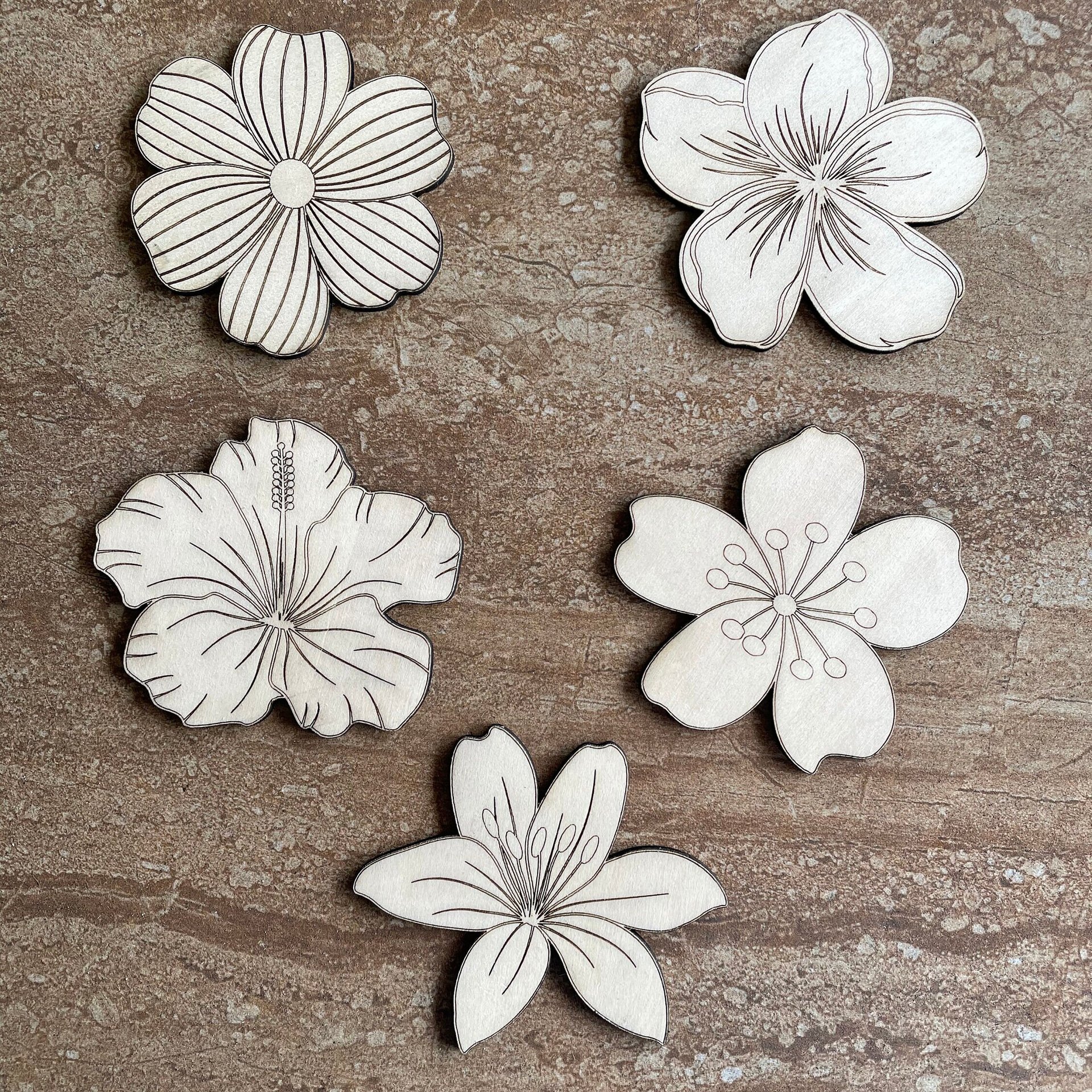 Handmade wooden DIY tropical flower cutouts in five unique styles, ready for paint or decorating