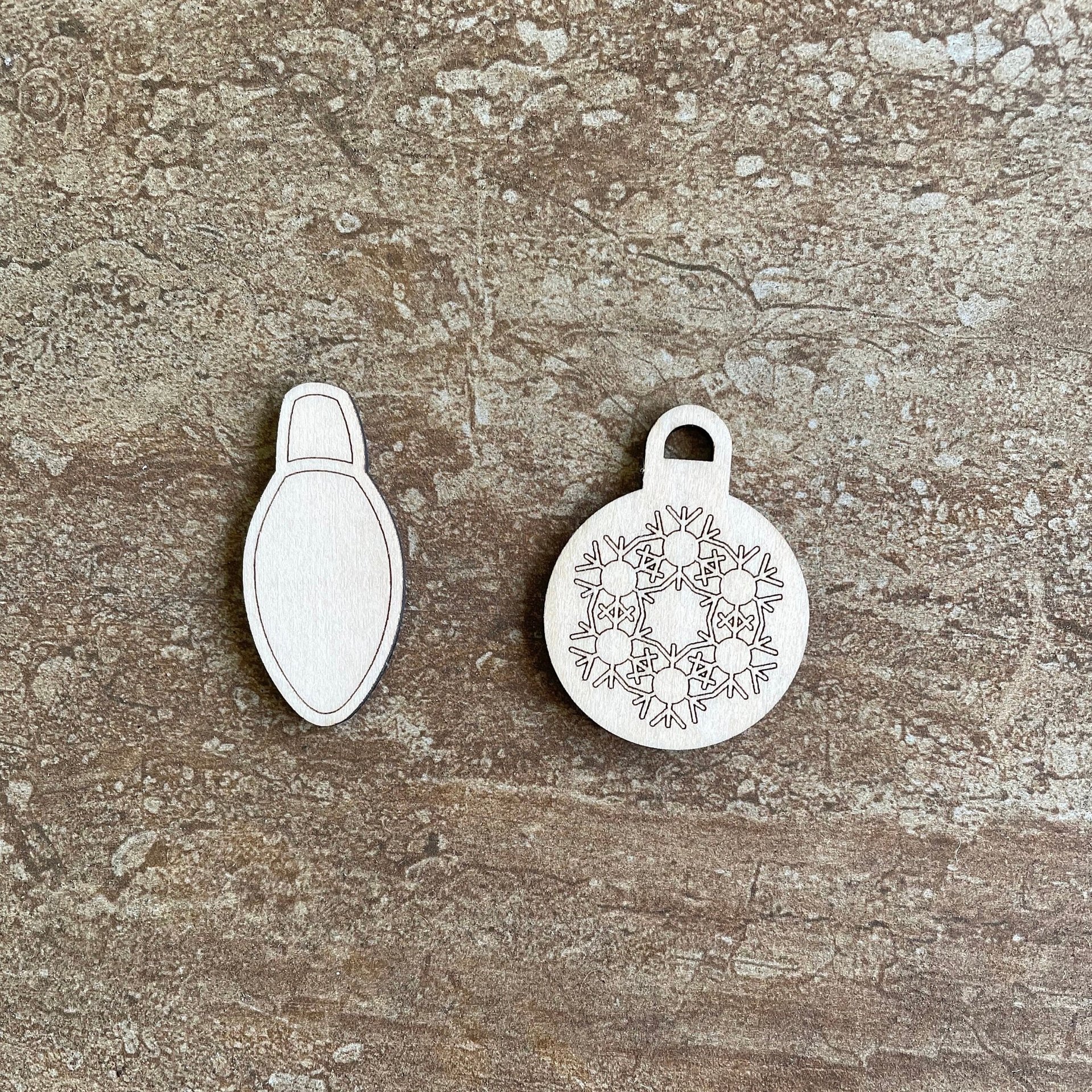 Handmade wooden DIY Christmas bulb cutout in two unique styles, ready for paint or decorating