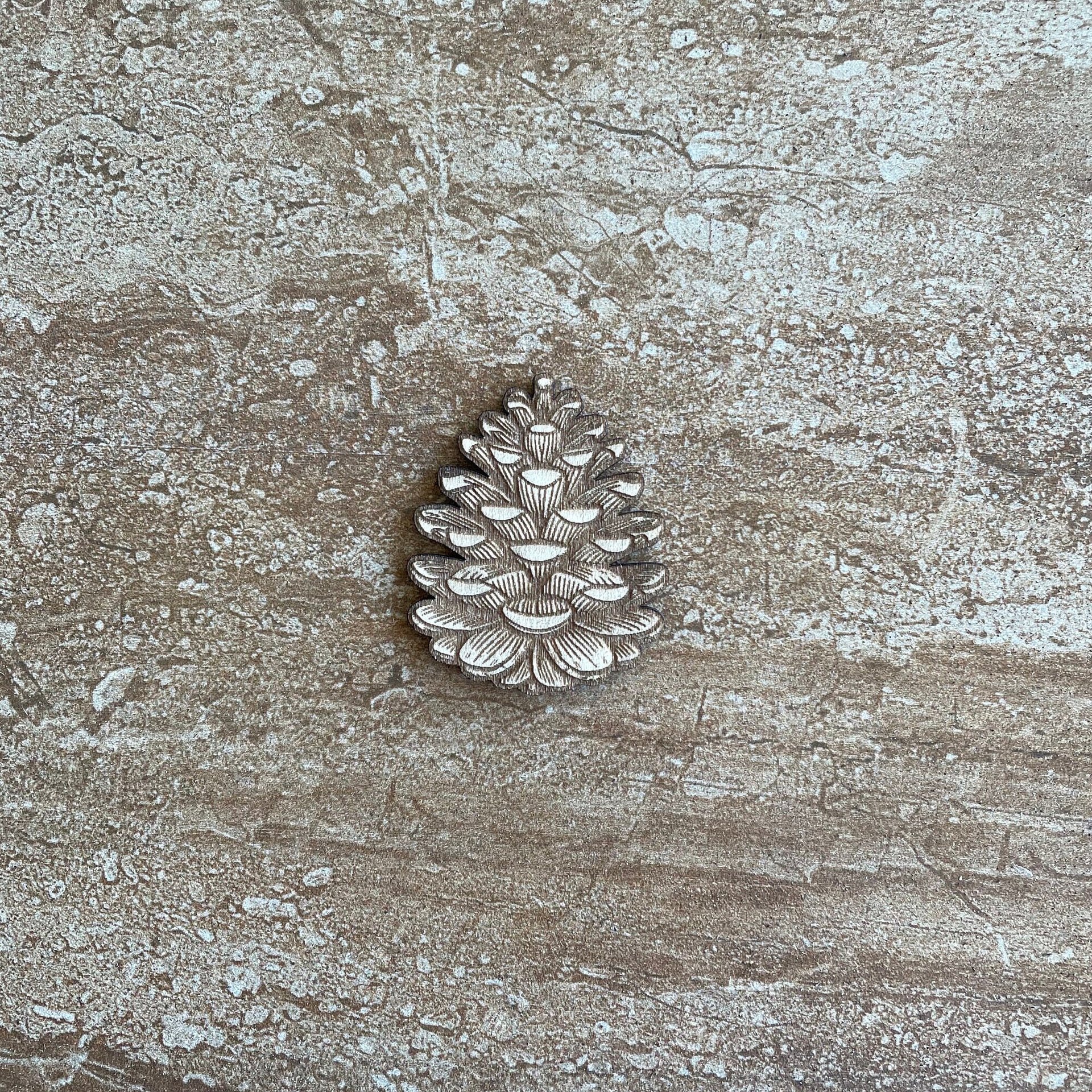 Handmade wooden DIY pine cone cutout ready for paint or decorating