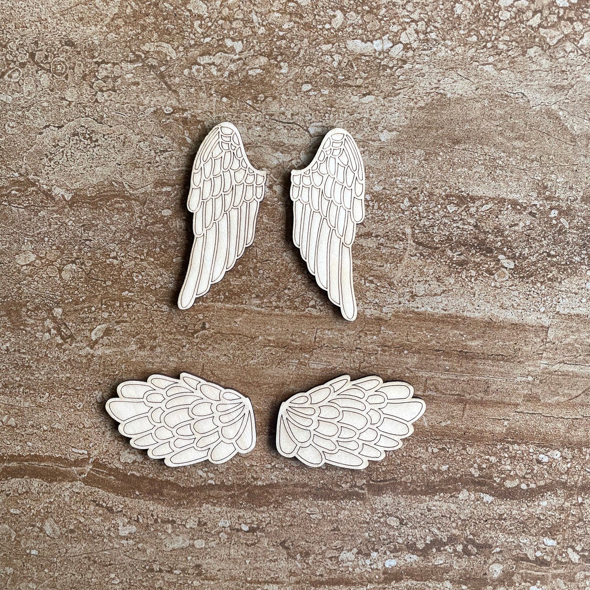 Handmade wooden DIY angel wing cutout in two unique styles, ready for paint or decorating