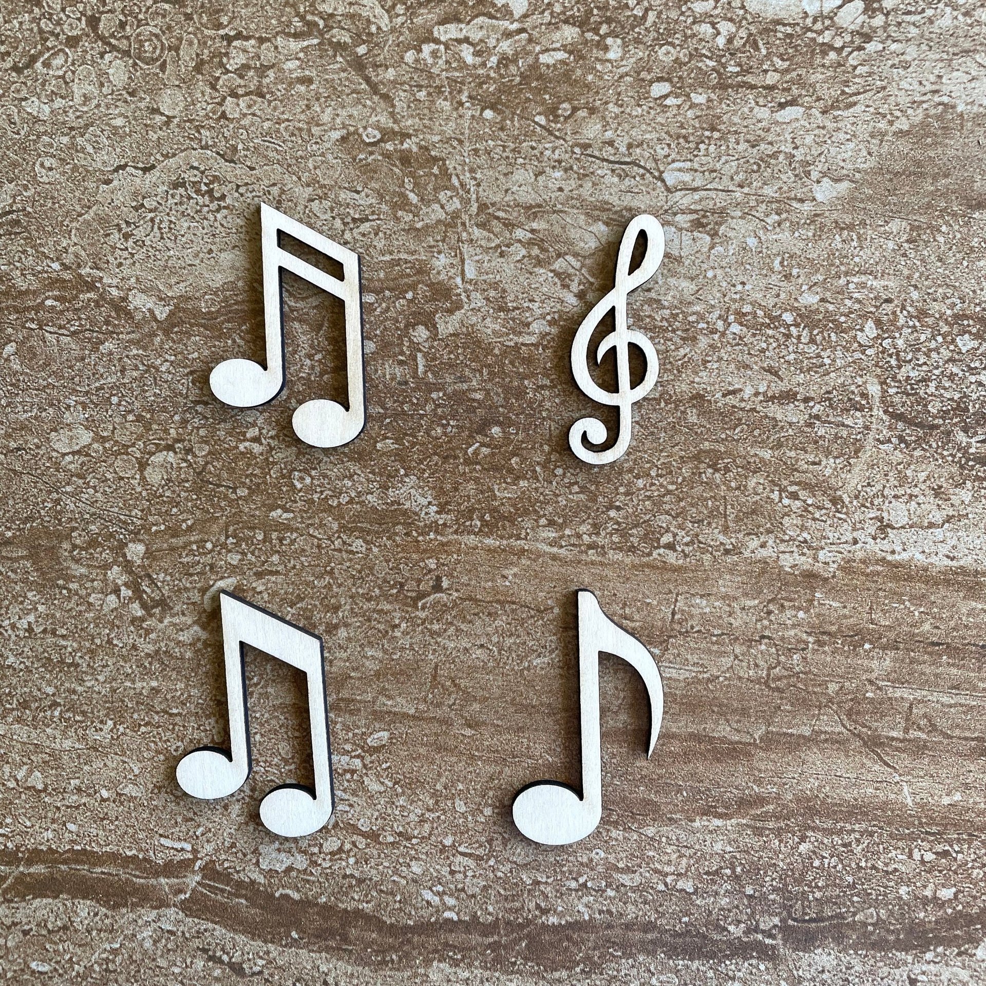 Handmade wooden DIY musical note cutout in four unique styles, ready for paint or decorating