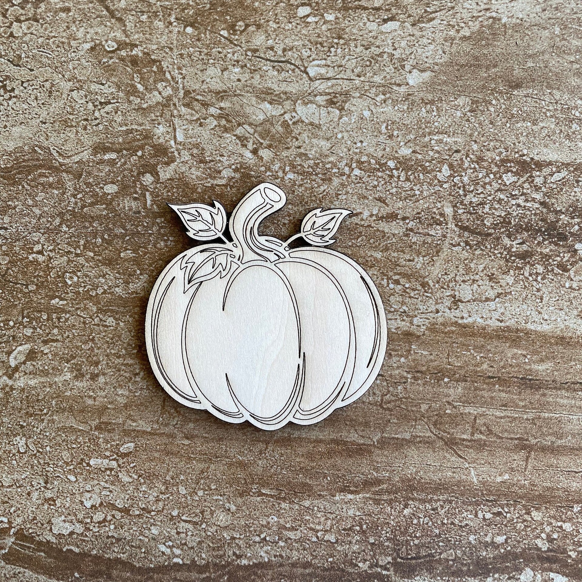 Handmade wooden DIY pumpkin cutout ready for paint or decorating