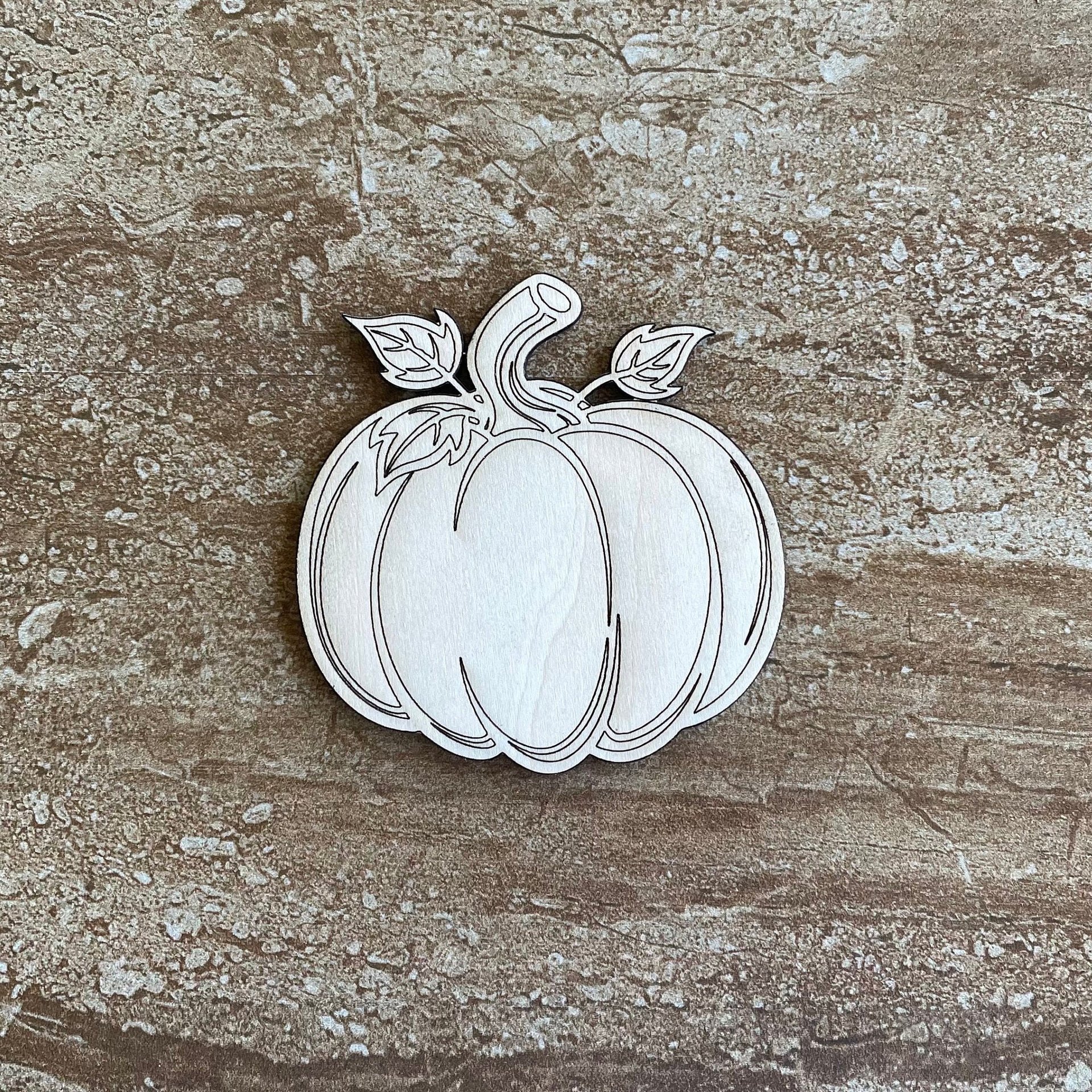 Handmade wooden DIY pumpkin cutout ready for paint or decorating