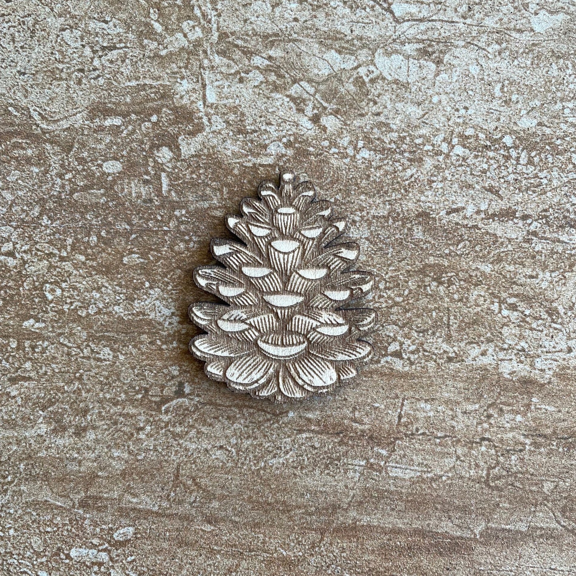 Handmade wooden DIY pine cone cutout ready for paint or decorating