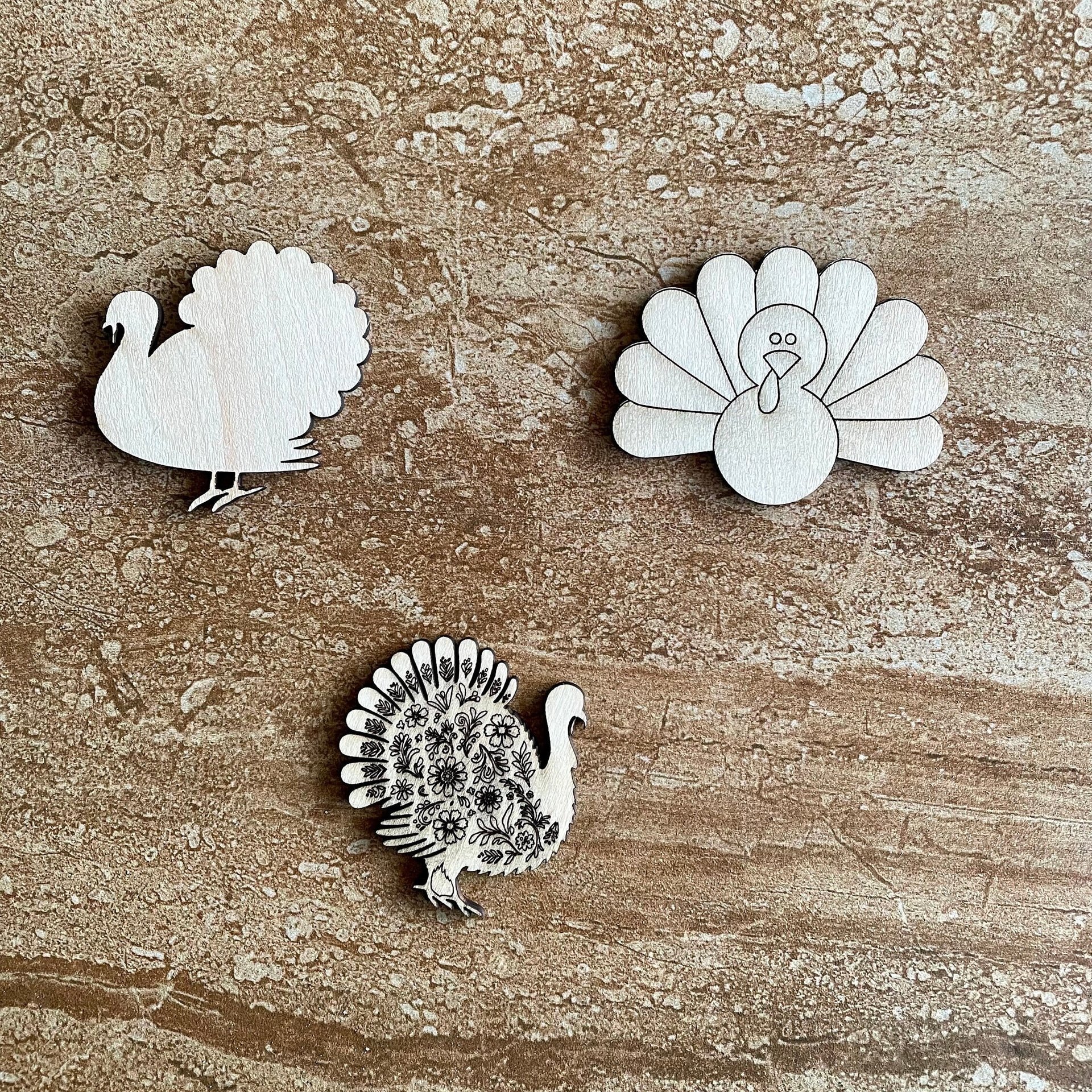 Handmade wooden DIY Thanksgiving turkey cutout in three unique styles, ready for paint or decorating