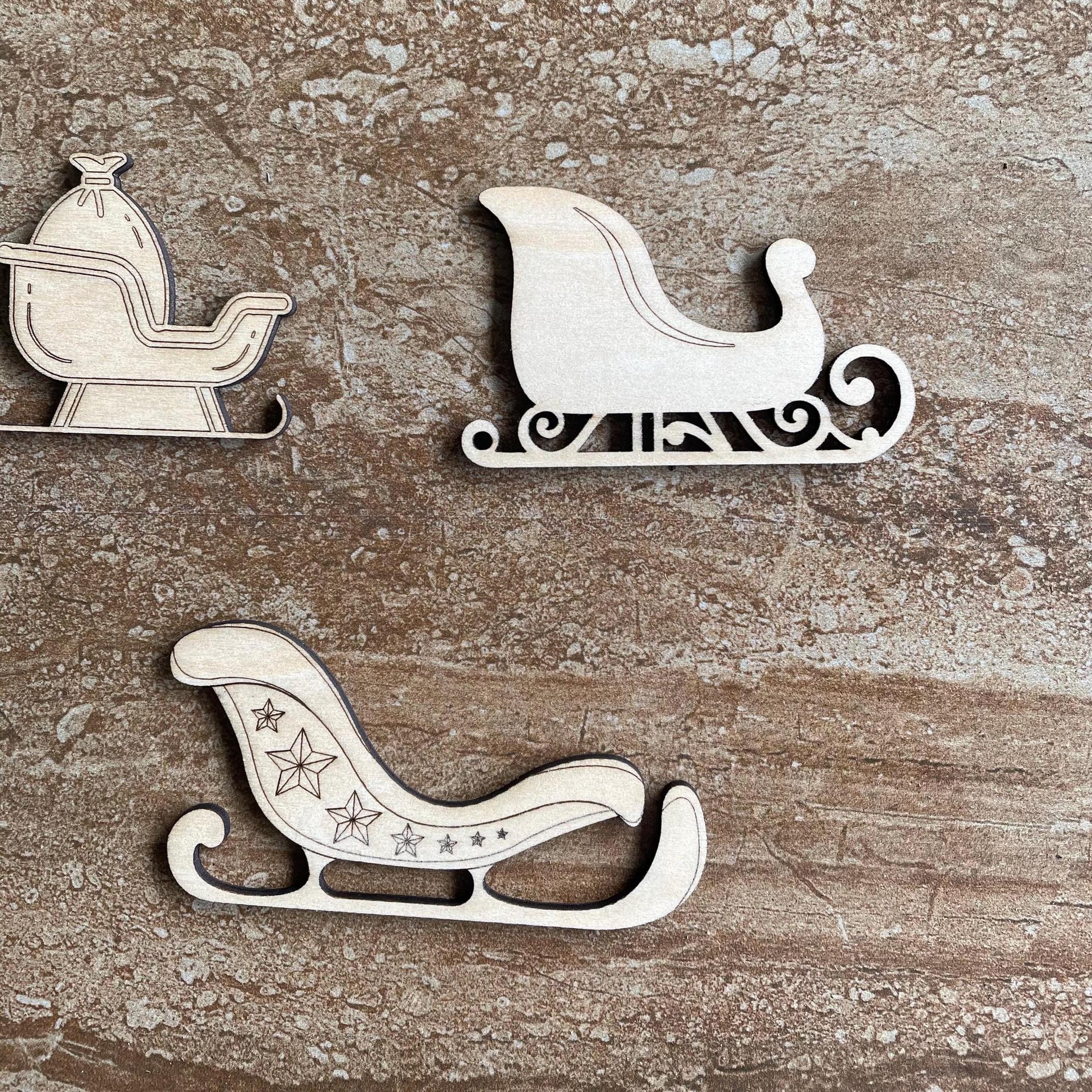 Handmade wooden DIY Christmas sleigh cutout in three unique styles, ready for paint or decorating