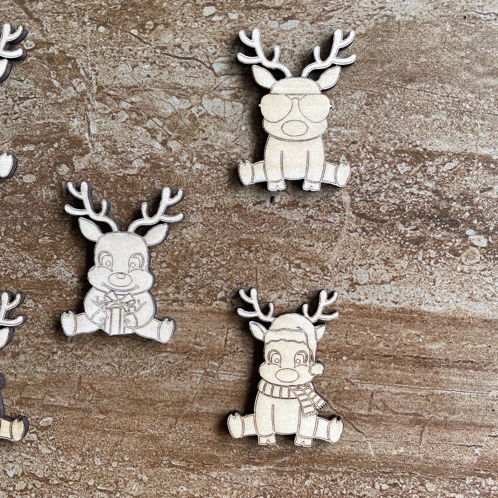 Handmade wooden DIY reindeer cutout in five unique styles, ready for paint or decorating