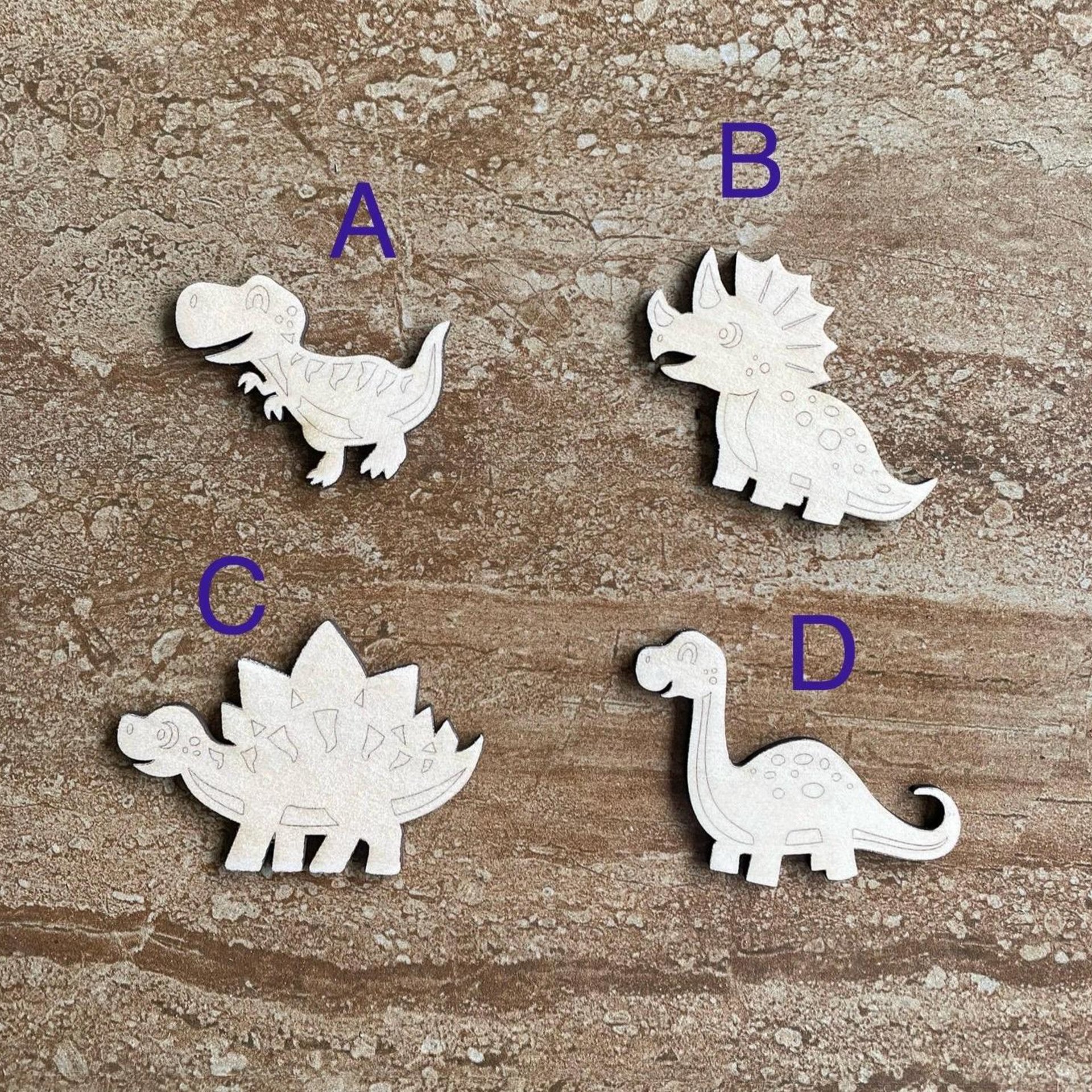 Handmade wooden DIY dinosaur cutout in four unique styles, ready to paint or decorate