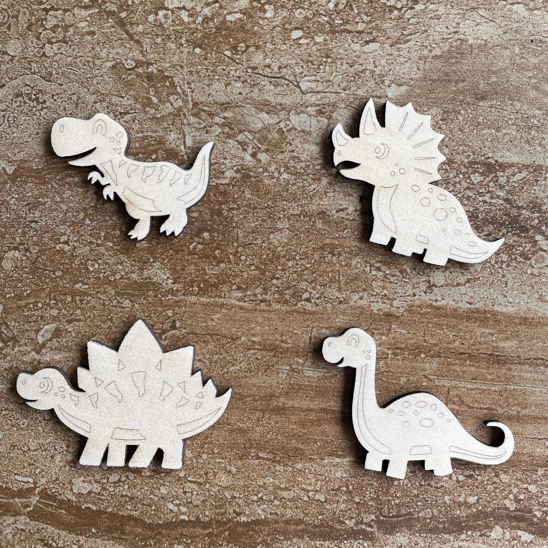 Handmade wooden DIY dinosaur cutout in four unique styles, ready to paint or decorate